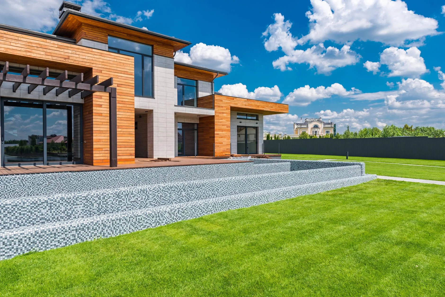 Courtyard of a modern villa with glass walls